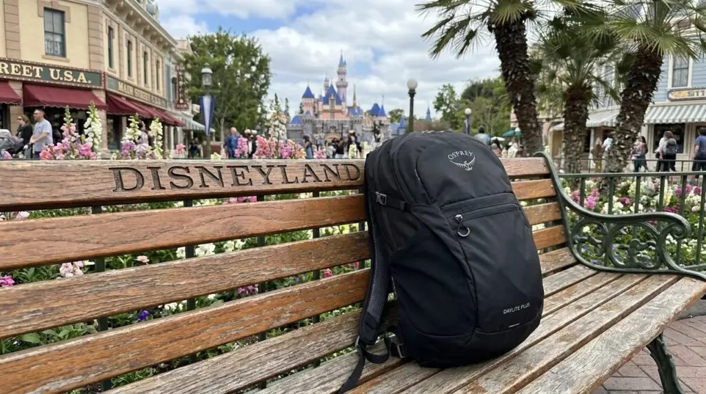 Osprey Daylite Plus lite backpack sitting on a disneyland park bench