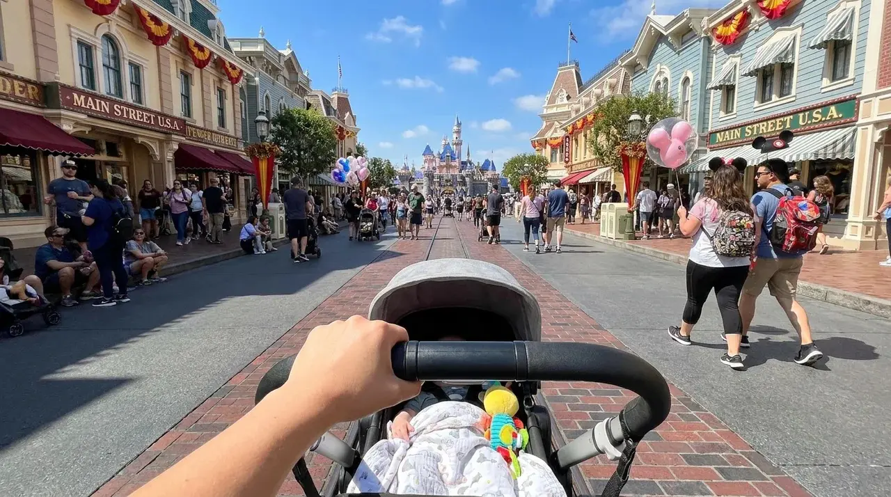 Pushing a stroller through Main Street at Disneyland, POV View.