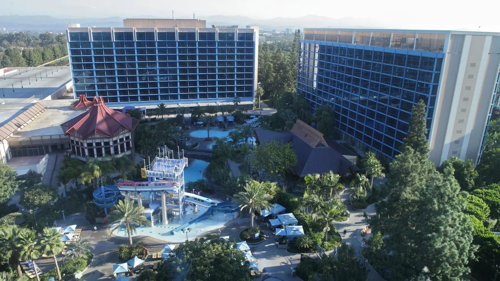 Exterior of the Disneyland Hotel towers and landscaping at Disneyland Resort in Anaheim, California