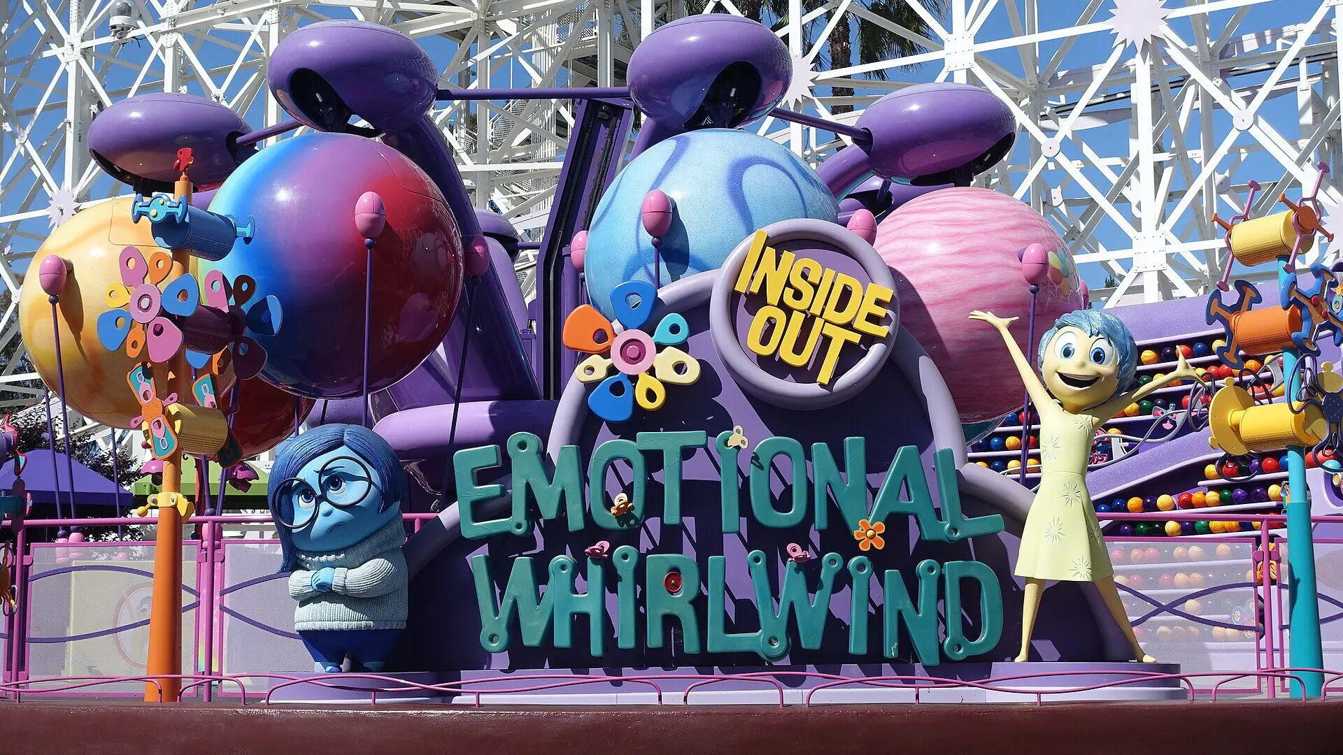 Inside Out Emotional Whirlwind attraction entrance and colorful ride vehicles on Pixar Pier at Disney California Adventure