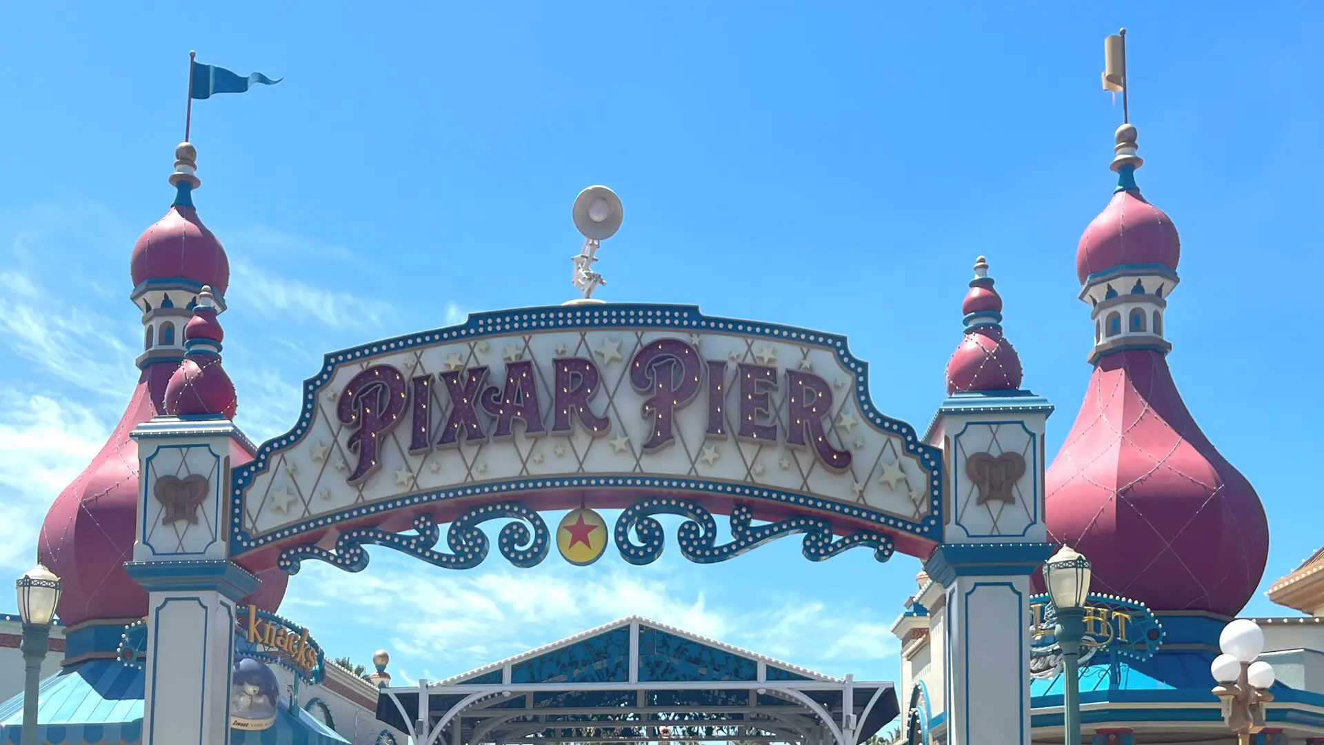Pixar Pier entrance arch at Disney California Adventure in Anaheim, with the land marquee over the walkway
