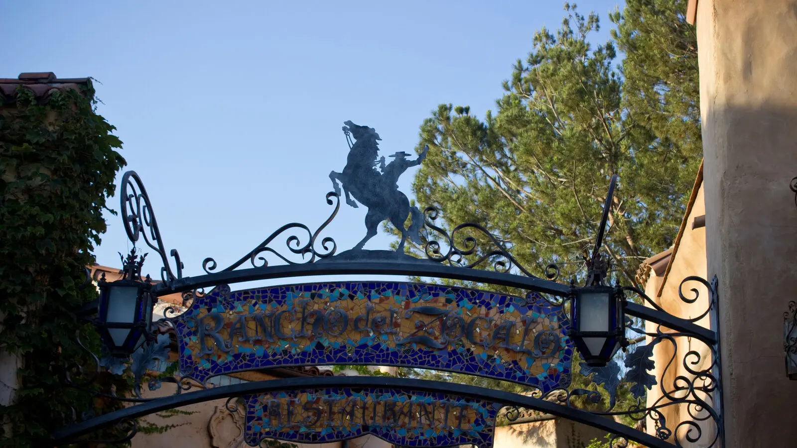 Rancho del Zocalo Restaurante entrance sign with wrought iron and blue mosaic tile in Frontierland at Disneyland Park