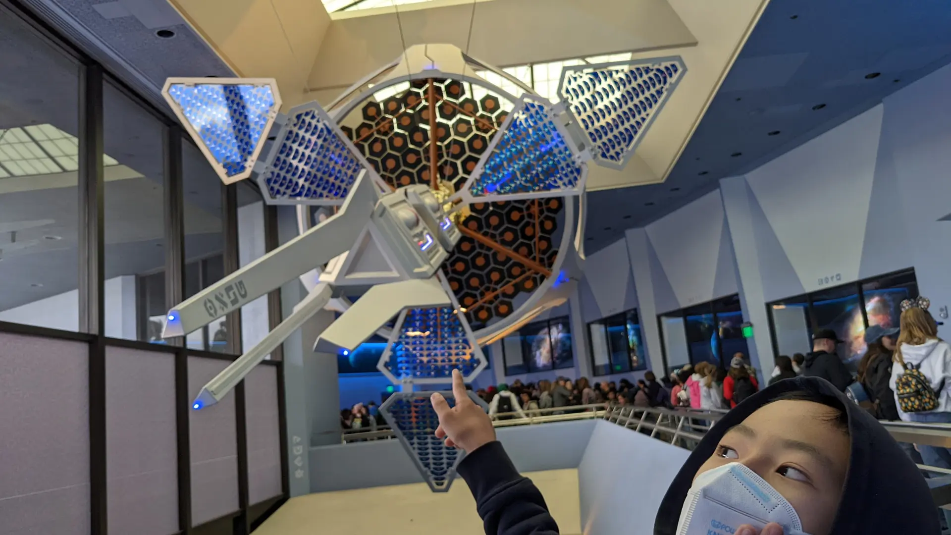 Guests walking toward Space Mountain at Disneyland