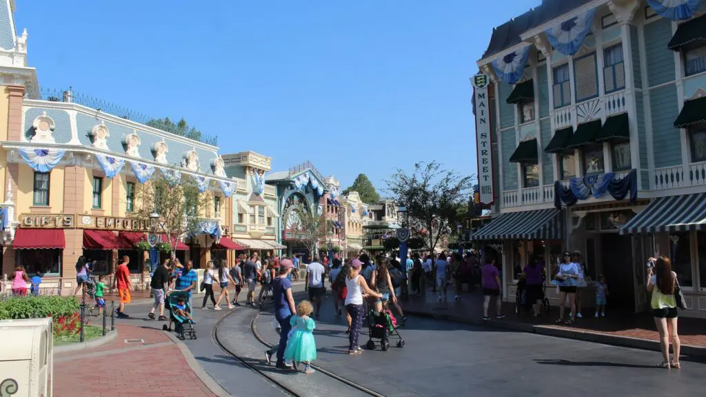 Guests walking down Main Street U.S.A. at Disneyland Park